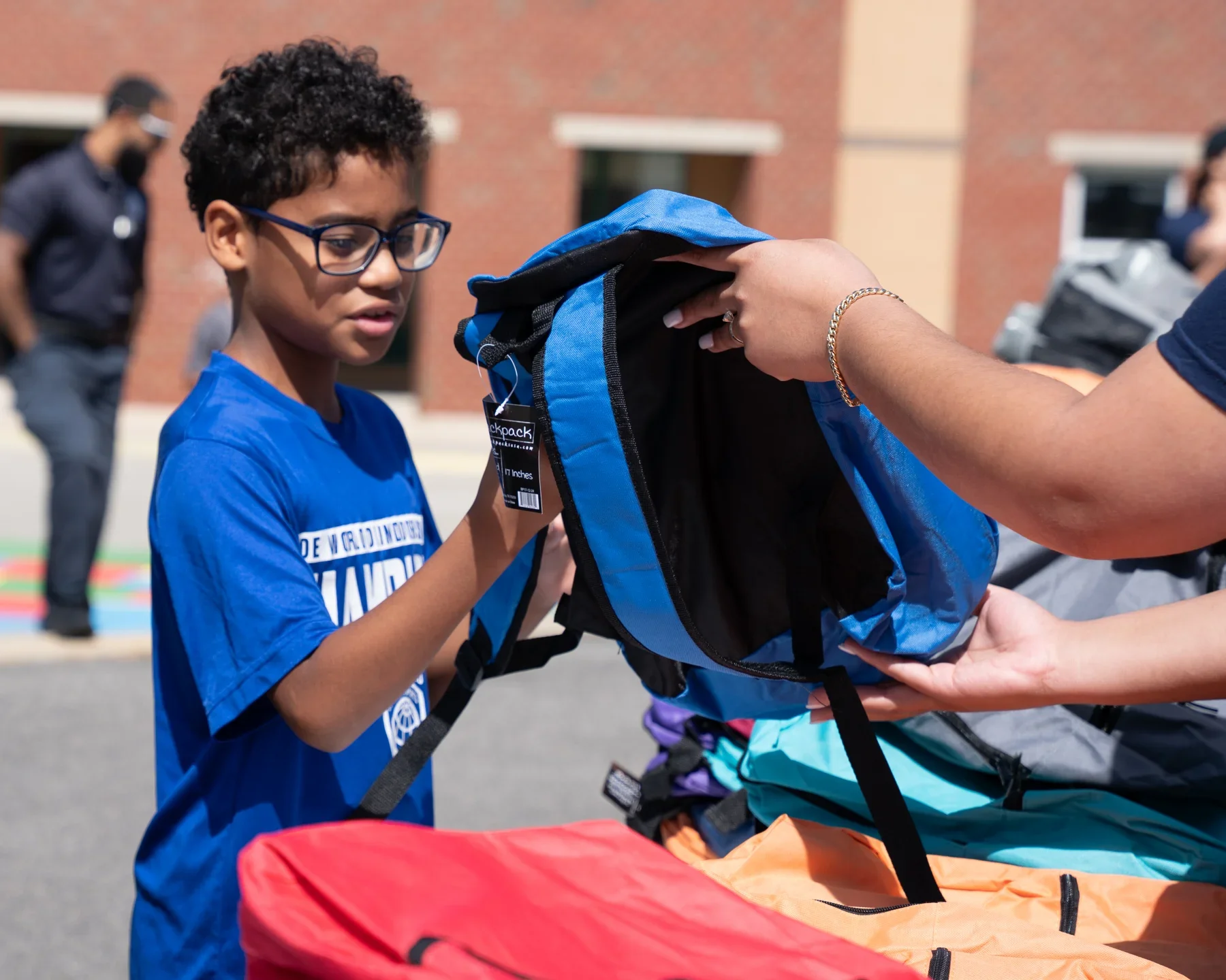 School backpack with notebooks and colored pencils