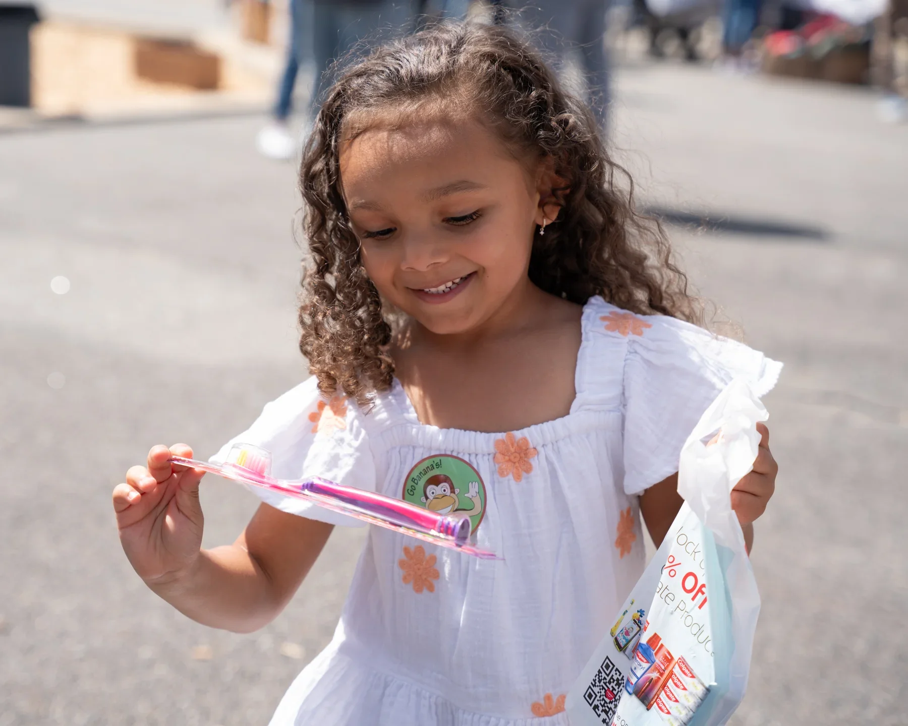 A student receiving colorful school materials